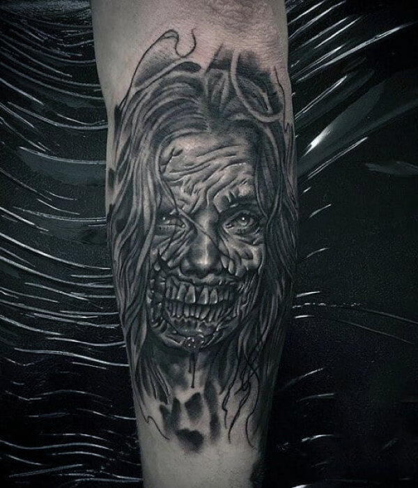 Black And Grey Ripped Skin Zombie Face Tattoo design