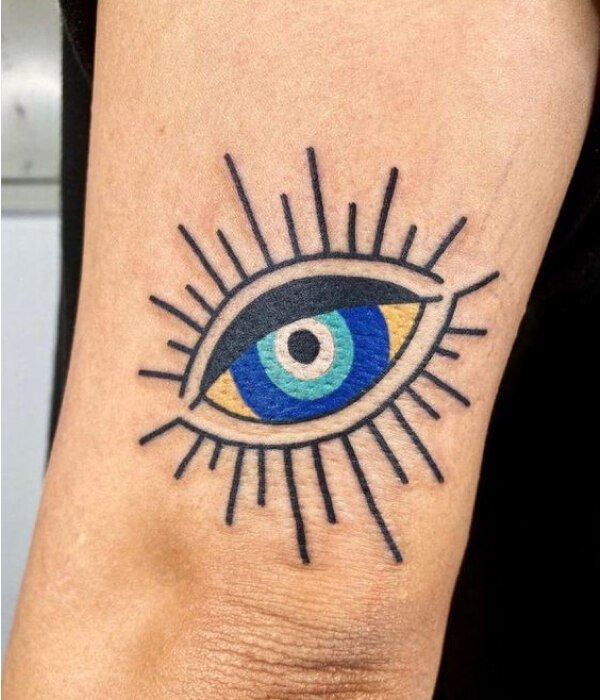 Yellow Evil Eye Tattoo