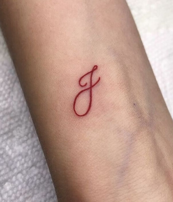 Cursive T tattoo