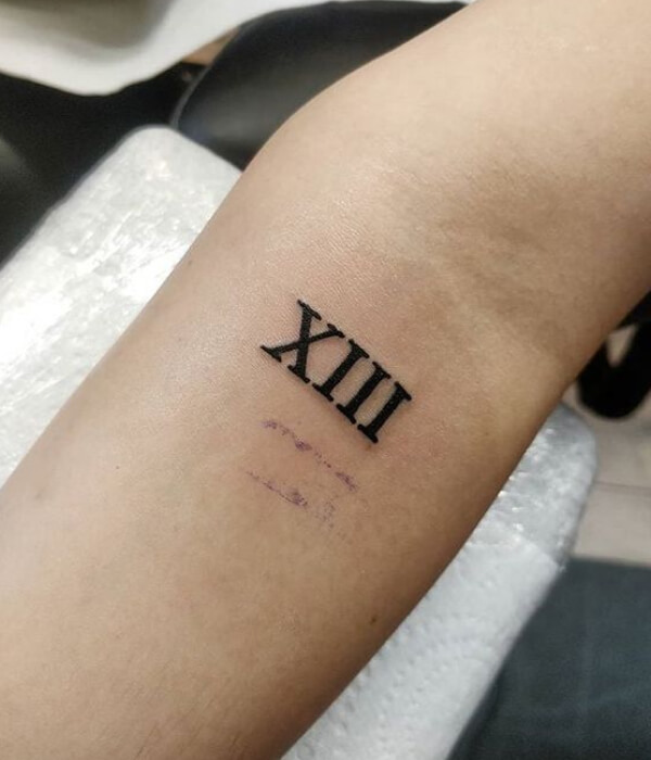 Roman Numeral T tattoo design