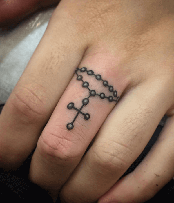 Rosary Tattoo Encircling Middle Finger Design