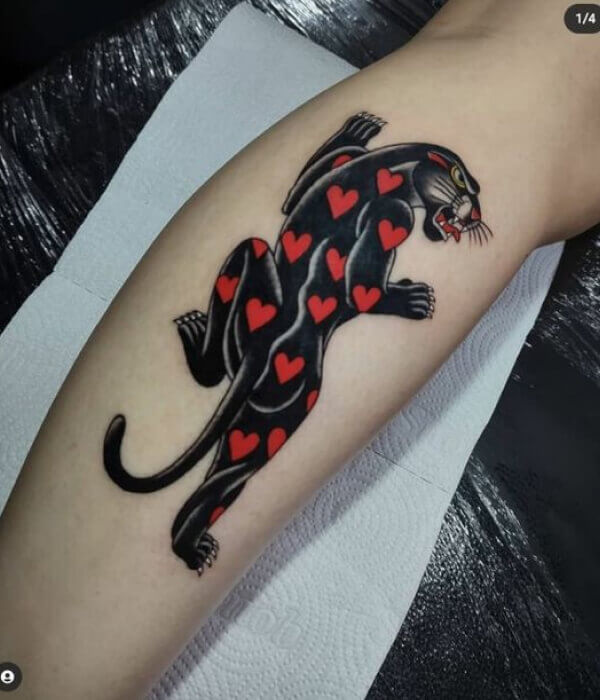 A panther with a dagger piercing its heart