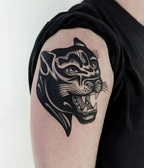 Panther head with an open jaw and sharp teeth Tattoo