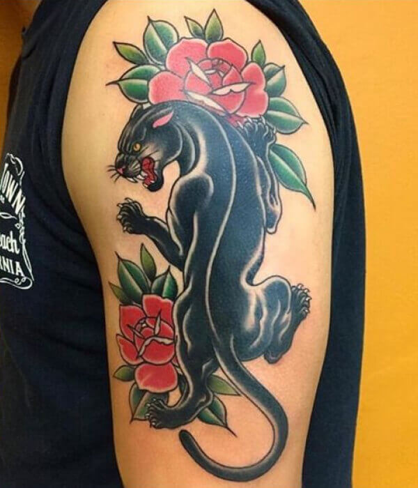 Panther nestled among vibrant roses Tattoo