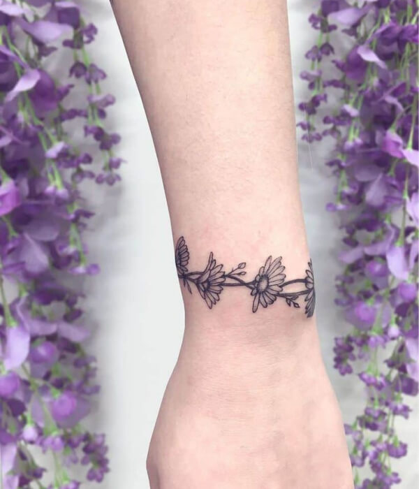 Minimalist Daisy Chain Tattoo