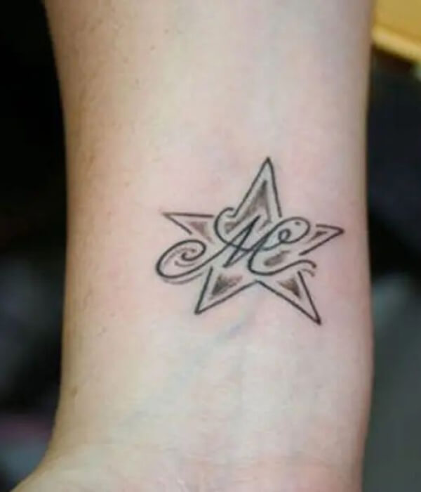 Letter M With Star Tattoo