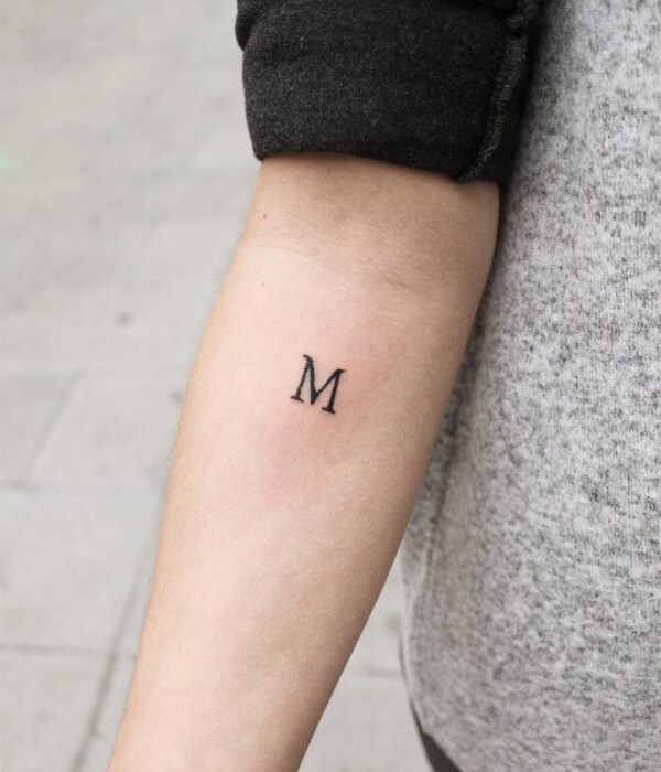 Simple M Initial Tattoo on Arm
