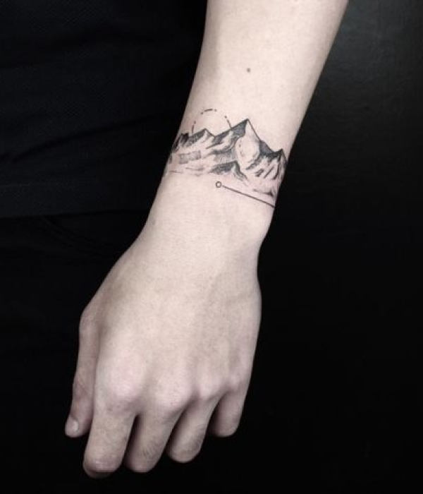 Thin Band Tattoo Of Dotwork Mountains On Arm