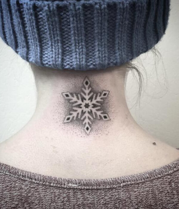 Negative Space Snowflake Tattoo
