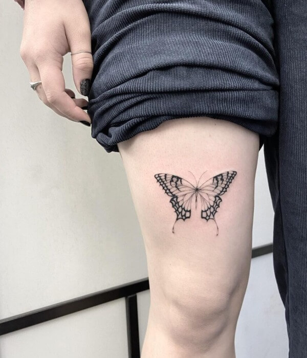Delicate Strength Butterfly Thigh Tattoo