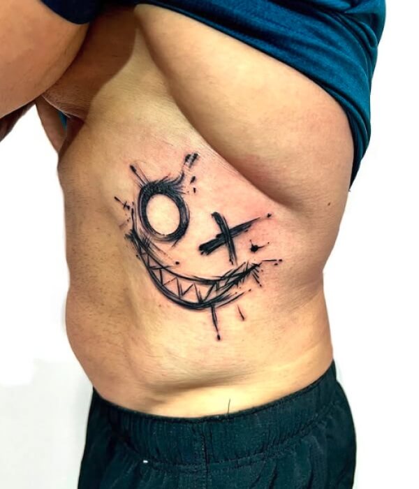 XO with a Smiley Face Tattoo - Trending Tattoo XO-with-a-Smiley-Face-Tattoo