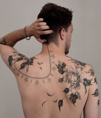 How do you approach the placement and flow of a tattoo on the body