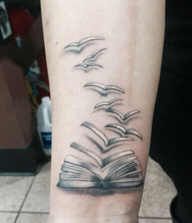 Open Book with Flying Pages