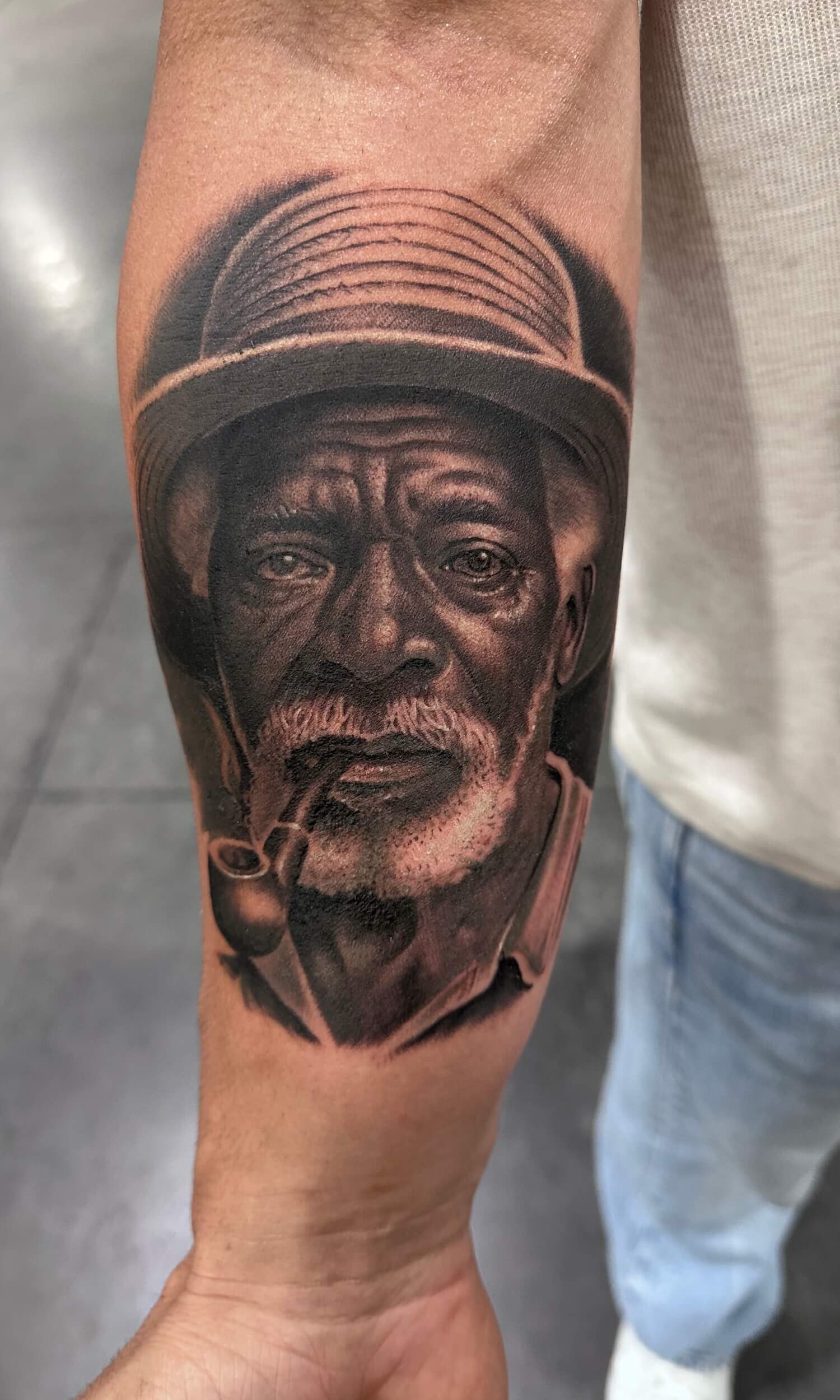Portrait tattoo on hand 