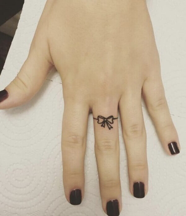 Bow Tattoo on Finger
