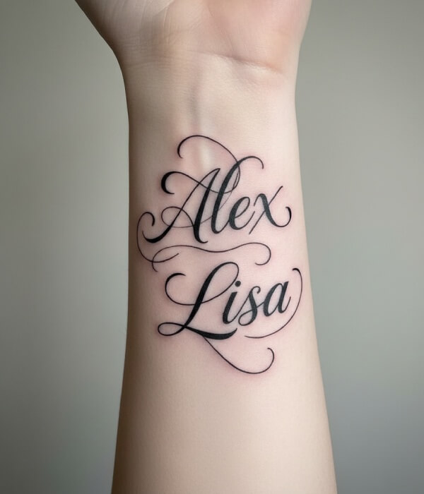 Ambigram name tattoo on the forearm featuring the names “Alex” and “Lisa” in elegant calligraphic script, designed to read clearly from different angles in black ink.