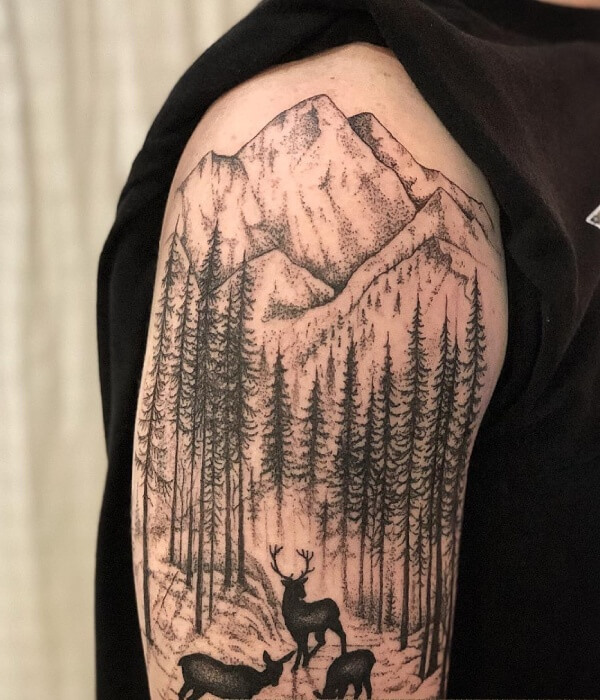 A small, circular blackwork tattoo on a wrist depicting a woman and a fox walking through a silhouetted forest under a full moon.