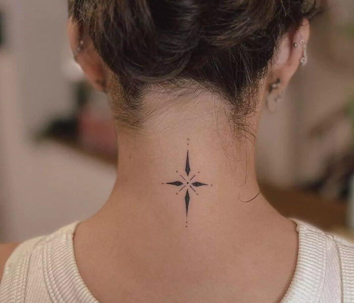 Minimalist Zodiac Neck Tattoo - Trending Tattoo Minimalist zodiac-inspired compass star tattoo with fine-line dots placed at the back of the neck.