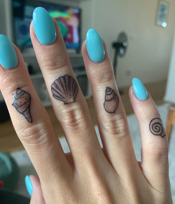 Minimalist shell finger tattoos featuring small seashell, scallop, conch, and spiral shell designs on fingers with turquoise nail polish.