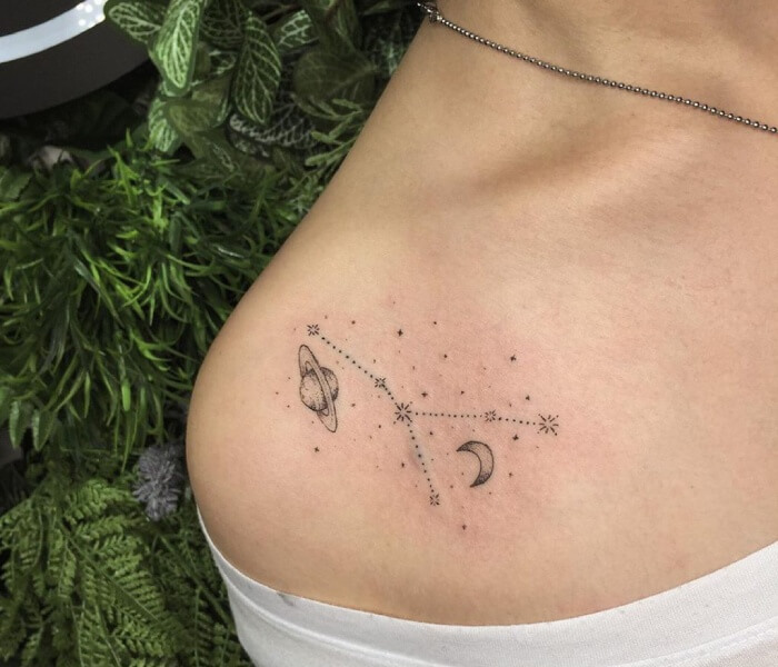 Tiny Zodiac Tattoos on the Collarbone 1 - Trending Tattoo Tiny zodiac constellation tattoo with moon, stars, and planet symbols delicately placed along the collarbone.