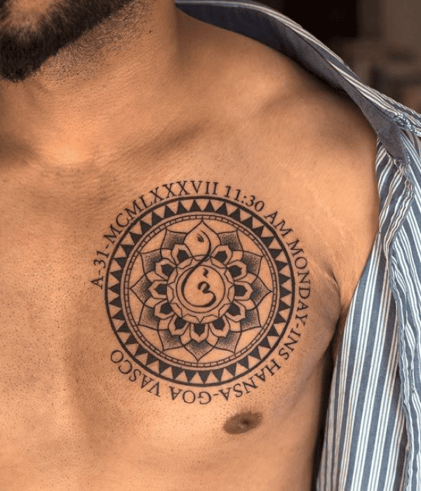 Sacred geometry mandala tattoo on the chest with Om symbol and Roman numerals, symbolizing spirituality, time, and inner balance.