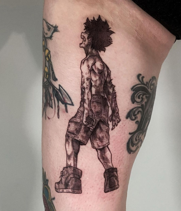 A black-and-grey forearm tattoo of Levi Ackerman from Attack on Titan, depicted in a dynamic combat stance with his swords drawn.